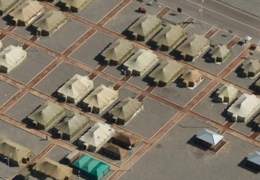 Overhead aerial shot of a military base in the rocky mountains